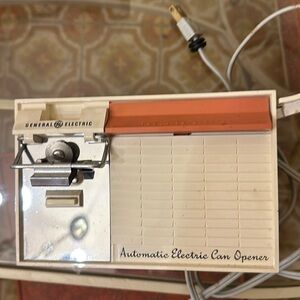 Calling all mid-century, modern fans, you need this pink and cream can opener